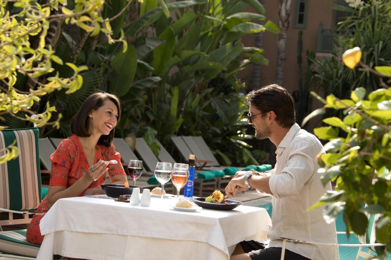 Les Jardins De La Medina Hotel Marrakesh Exterior photo A couple dining at the hotel